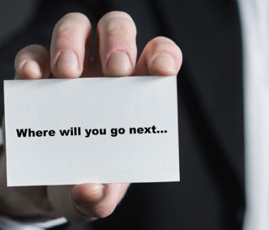 person holding a business card for career counseling