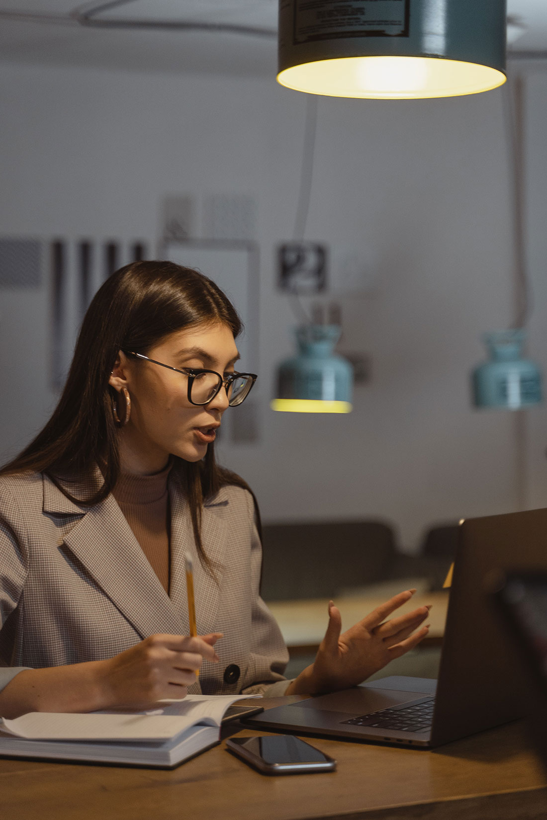 woman sitting at desk working at laptop