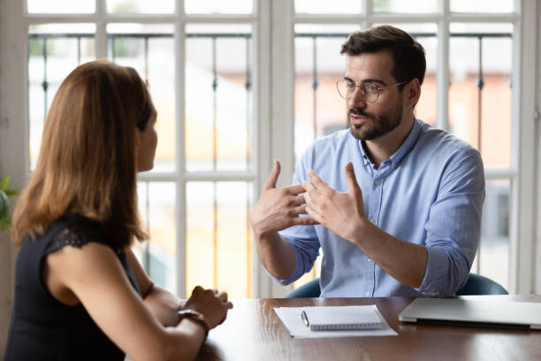 male boss talking to female employee